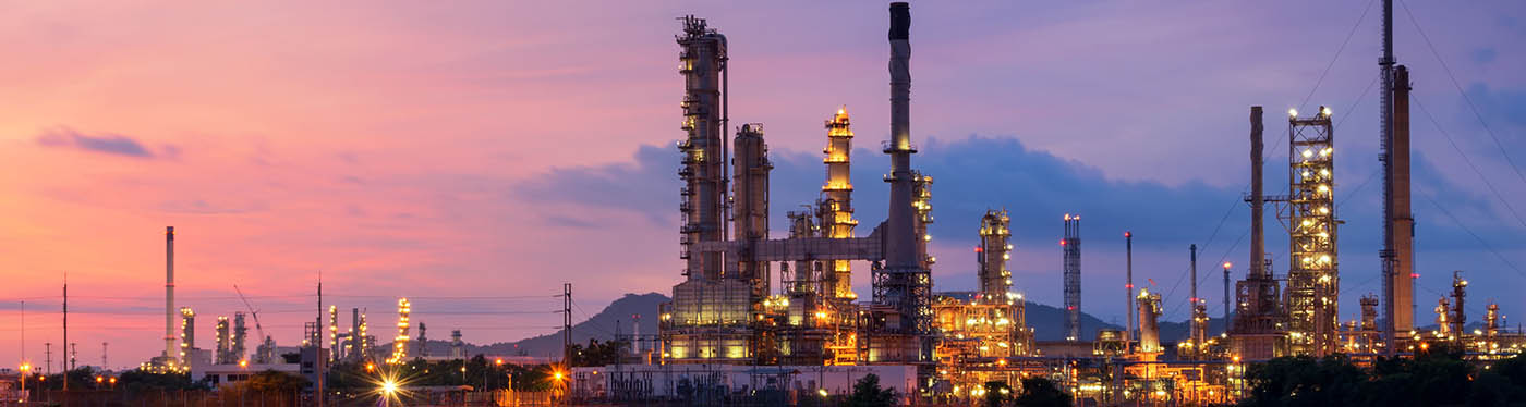 billboard refinery at dusk